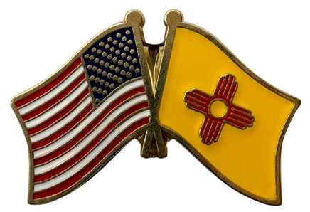 A double flag pin with the American flag on the left and the New Mexico state flag on the right.
